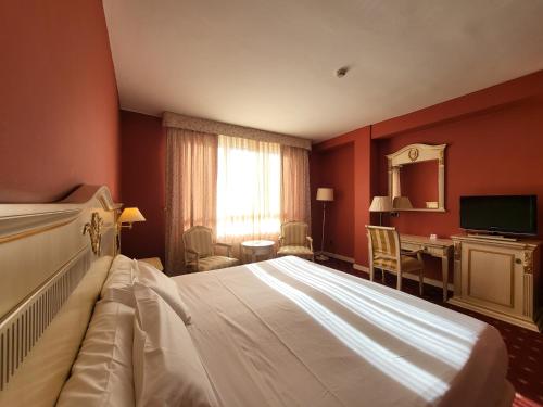 Postel nebo postele na pokoji v ubytování Hotel Leonor Mirón