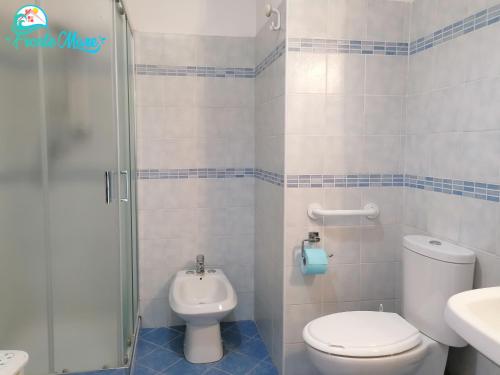 a bathroom with a toilet and a sink and a shower at CASA FRONTE MARE in Santa Teresa di Riva
