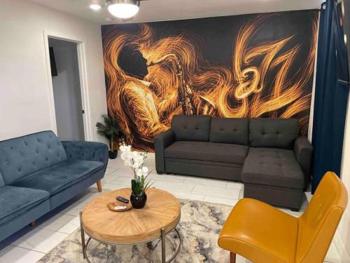 a living room with a couch and a table at Your Downtown Home With California King Bed Unit A in Phoenix