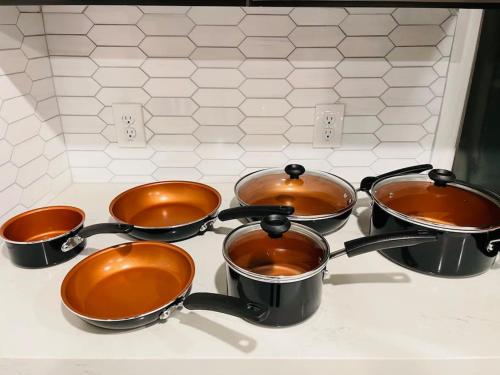 a group of pots and pans on a stove at Your Downtown Home With California King Bed Unit A in Phoenix