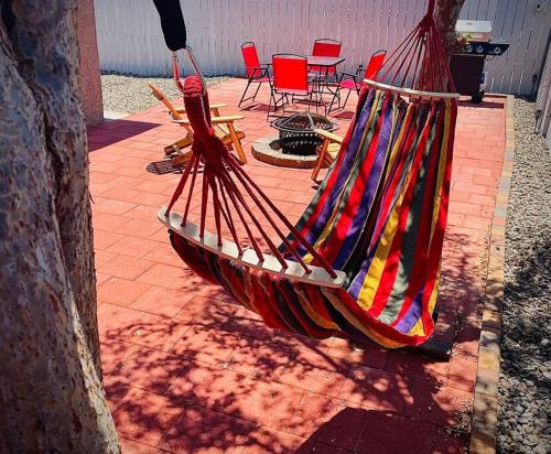 a hammock sitting on a brick patio with chairs at Your Downtown Home With California King Bed Unit A in Phoenix