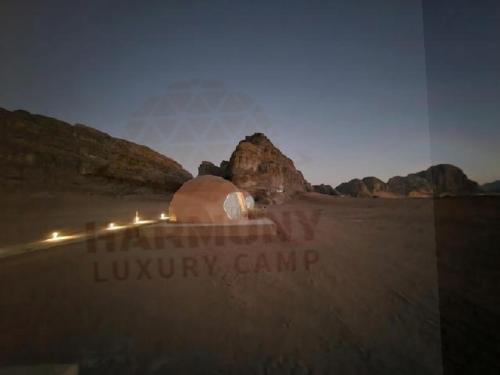 a view of a luxury camp in the desert at night at Harmony Luxury Camp in Wadi Rum