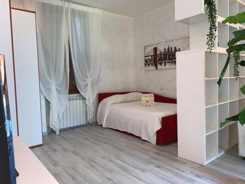 a bedroom with a bed with two teddy bears on it at CASA CLAUDY in Vimodrone
