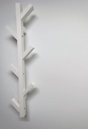 a white shelf on a white wall at Cozy Stay Apartments in Salzburg