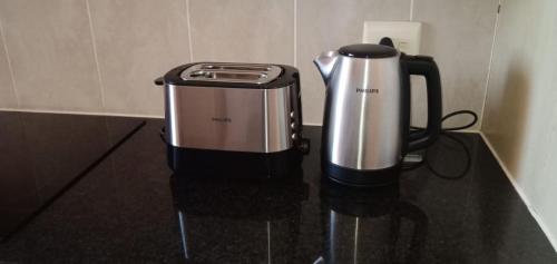 a coffee maker sitting on top of a counter at Bougain Villas in Cape Town