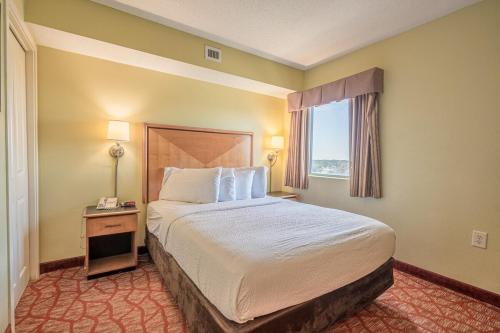 a hotel room with a bed and a window at Bay View 1011, City View, 4ppl in Myrtle Beach