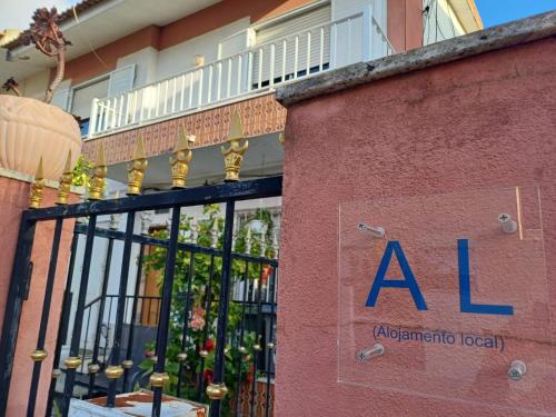 a building with a al sign on the side of it at Flamingo's Bay in Corroios