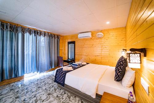 a bedroom with a large bed in a room at orange sky beach bungalow in Agonda