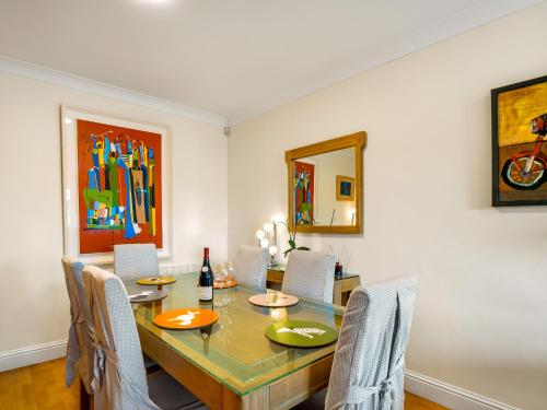a dining room with a table and chairs at Clifden Seaview - Spectacular Apartment, Connemara in Clifden