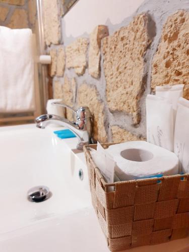 a bathroom with a toilet sitting on a sink at Piccolo Hotel Olina in Orta San Giulio