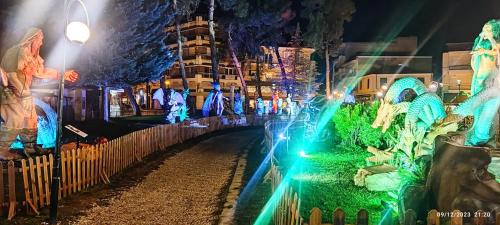 a view of a street at night with lights at Luxurious Japandi Loft in Ptolemaida