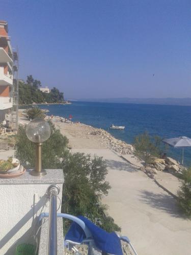 a view of the beach from a balcony at Apartments Toma Bajnice Directly in Krilo