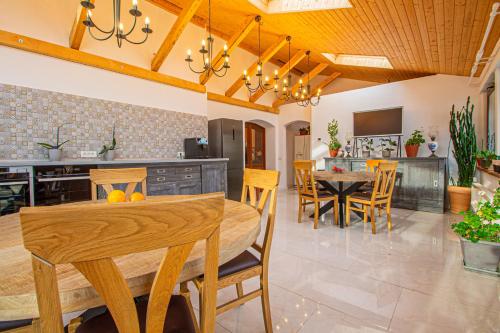 a kitchen and dining room with a table and chairs at RunCa-n Rai in Cristian