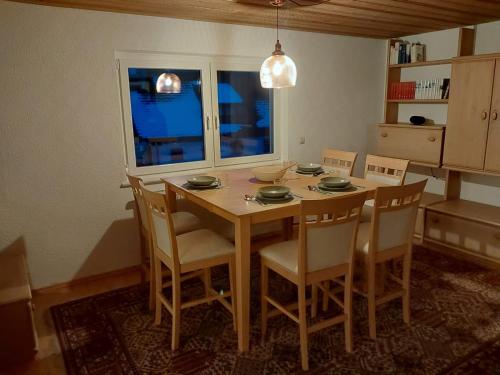 a dining room table and chairs in a room at Allgäu Bergblick in Leutkirch im Allgäu