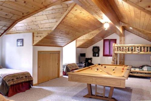 a room with a pool table in a house at Lakefront Estate W/Stunning Views in Big Bear Lake in Big Bear Lake