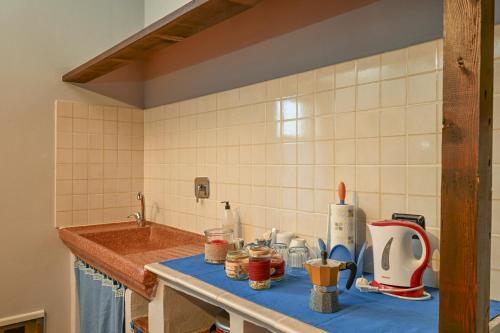 a kitchen counter top with a sink and a counter top at Agriturismo di Sordiglio in Casina