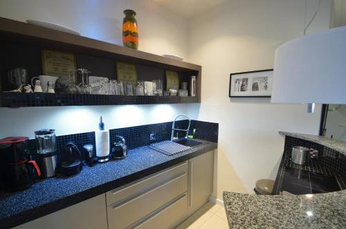 a kitchen with a sink and a counter top at -- Manhattan -- CENTRUM -- STARÓWKA -- in Kołobrzeg