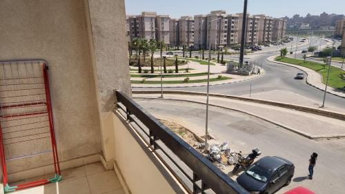 a balcony of a building with a view of a street at Gardenia City cairo airport in Cairo