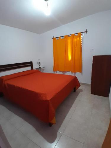 Postel nebo postele na pokoji v ubytování Santo Cura Brochero zona centro