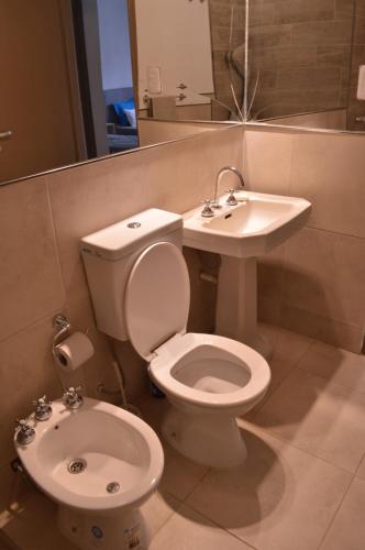a bathroom with a toilet and a sink at SUNNY HOUSE BOULEVARES 4/5pax in Córdoba