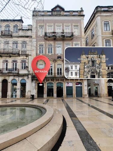 a building with a heart sign in front of it at Pensão Santa Cruz in Coimbra
