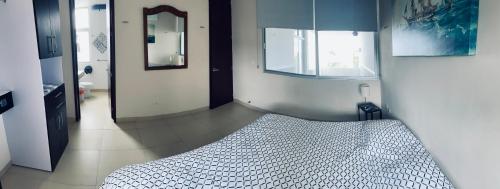 Ένα ή περισσότερα κρεβάτια σε δωμάτιο στο Apartments Artistic Mayan Accommodation - AMA Yucatan