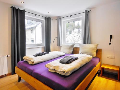 En eller flere senge i et værelse på Ferienwohnung Bergzauber 2 (inkl. MeineCardPlus)