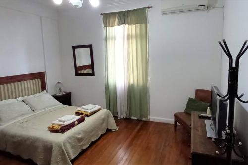 Ένα ή περισσότερα κρεβάτια σε δωμάτιο στο ¡Tu refugio acogedor en pleno centro de Buenos Aires!