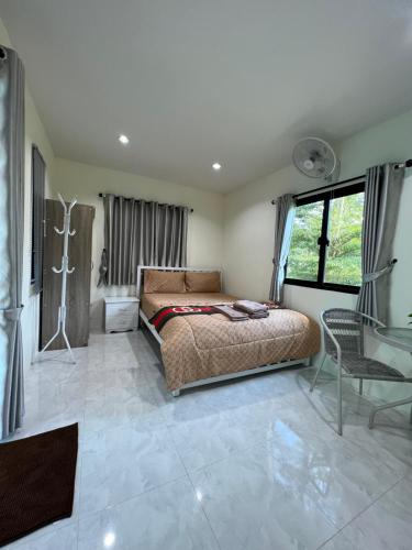 Postel nebo postele na pokoji v ubytování Pada Guesthouse Khaoyai