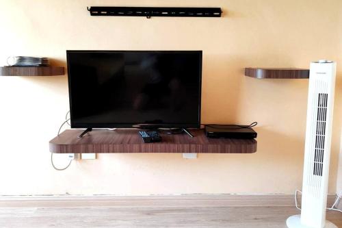 a flat screen tv on a wall at Silverpart Resort Fraser Hill B5-6-1 Forest View High Floor No lift in Bukit Fraser