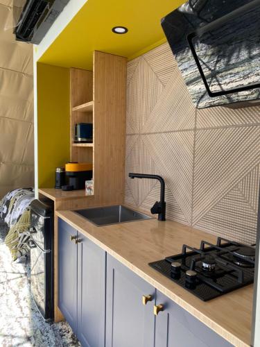 a kitchen with a sink and a counter top at Ross Beach TOP10 Holiday Park in Ross