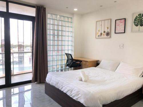 Postel nebo postele na pokoji v ubytování 9Trip Stay in Dalat Center Residence - 4 Star Service Apartment