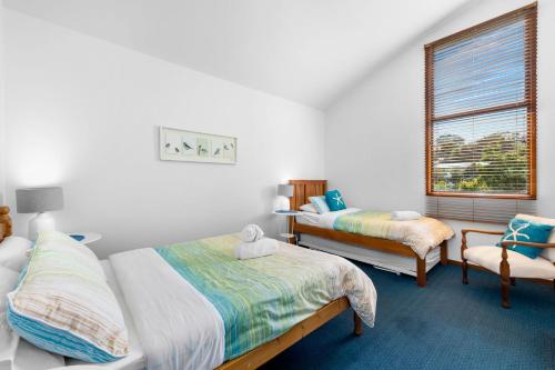 Postel nebo postele na pokoji v ubytování Aquarius Beach Stay - Belle Escapes Jervis Bay