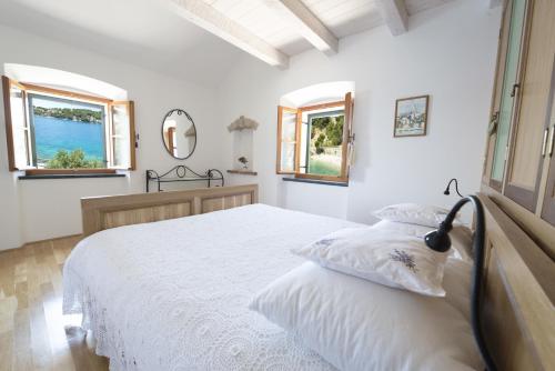 Giường trong phòng chung tại Villae Dalmaticae - Plava