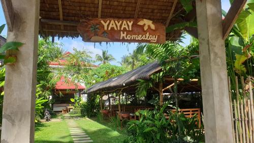 a restaurant with a sign that reads yaw nominary at Yayay Siargao in General Luna