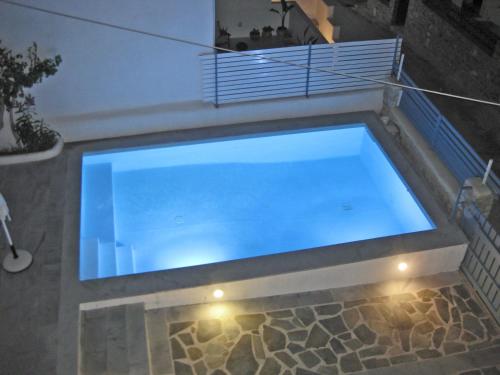 a large swimming pool in a house at Villa Danae - Seaside Villa with Pool & Hot Tub in Piso Livadi