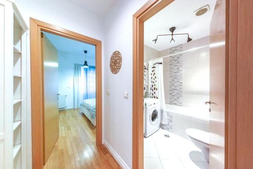 a bathroom with a sink and a washing machine at Old Town Spacious Apartment in Bucharest