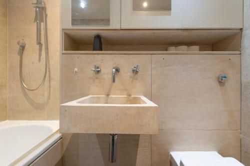 a bathroom with a sink and a shower at Elegant 1-BR Retreat in Ilford Centre in Ilford