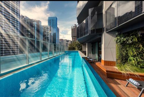 a swimming pool on the side of a building at 1 BRM, Sea View, Newly Renovated, Next to Crown in Melbourne