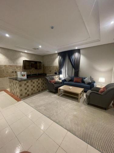 a living room with two couches and a table at Verona فيرونا in Riyadh
