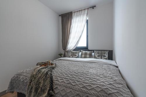 Katil atau katil-katil dalam bilik di Apartamenty Przełom Białki - plac zabaw, wiata grillowa