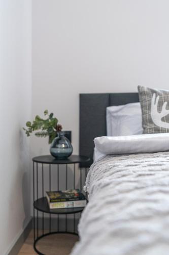 Katil atau katil-katil dalam bilik di Apartamenty Przełom Białki - plac zabaw, wiata grillowa