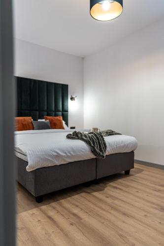Katil atau katil-katil dalam bilik di Apartamenty Przełom Białki - plac zabaw, wiata grillowa