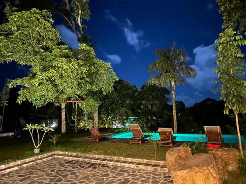 a resort with a swimming pool at night at Samalanka Boutique Hotel in Habaraduwa