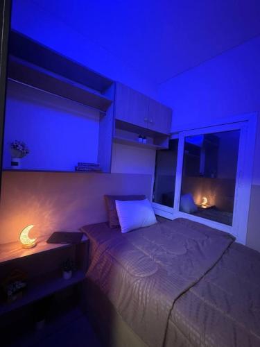 a bedroom with a bed with a blue ceiling at RksHome Couple or Solo Room Burjuman Metro Exit 4 in Dubai