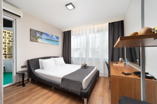 Postel nebo postele na pokoji v ubytování Nish Suites Atasehir