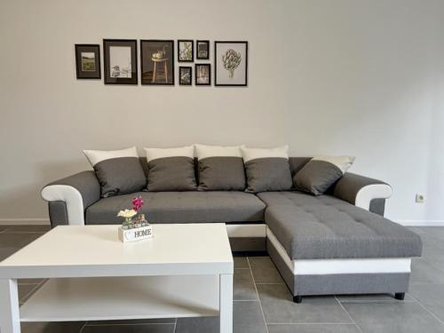 a living room with a couch and a table at Charbonnel 4 Bruxelles-Charleroi-airport in Charleroi