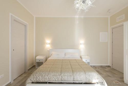 Postel nebo postele na pokoji v ubytování B&B Torre dei Monaci