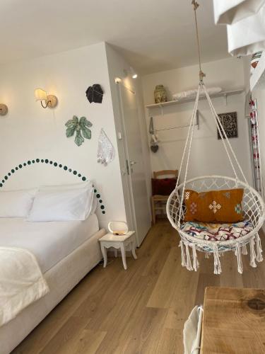a bedroom with a swing hanging from the wall at La Cascina di Bea in Torre Boldone