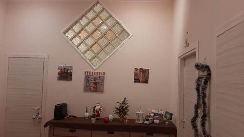 a room with a table and a window on the wall at Alba Ionica Taranto in Taranto